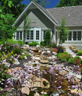 Landscape design in front of home, completed by Embassy Landscape Group.