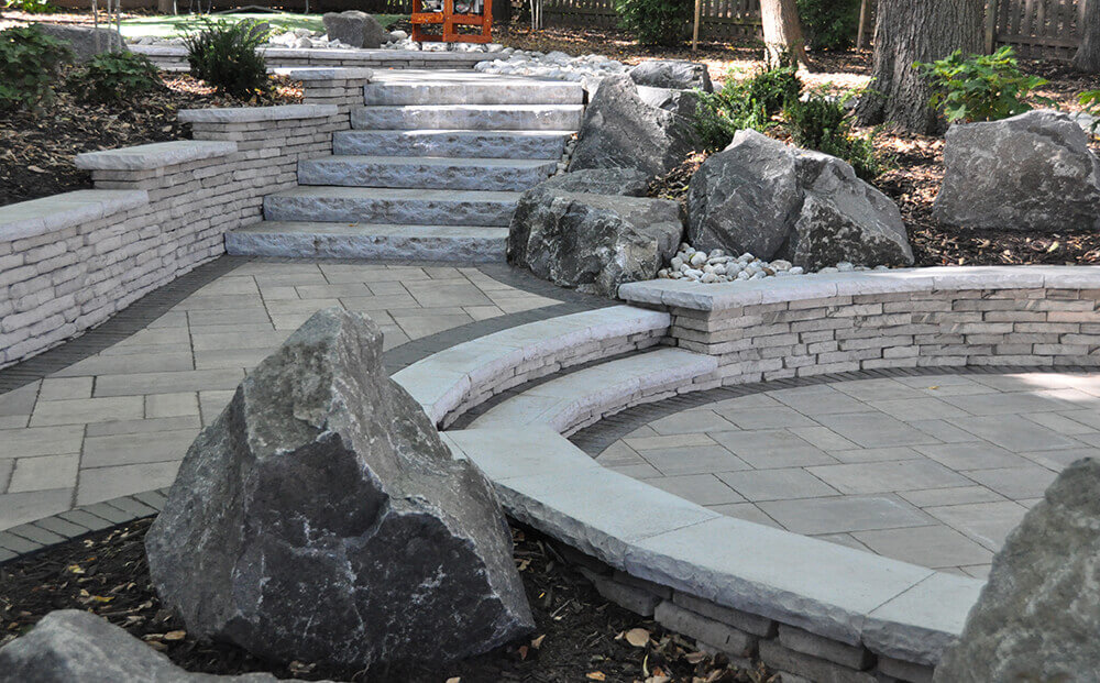 stones steps and sidewalk with built-in seating area