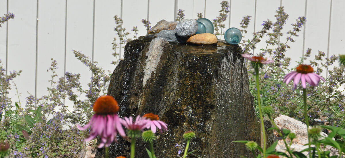 Outdoor living area with flowers, completed by Embassy Landscape Group.