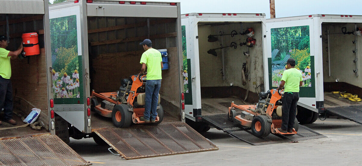 Embassy Landscape Group employees completing a maintenance job.