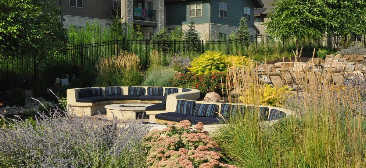 Landscape design with seating area and firepit, completed by Embassy Landscape Group.